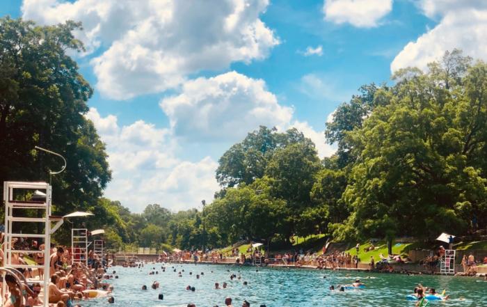 People swimming at Zilker Park, a natural pool in South Austin.