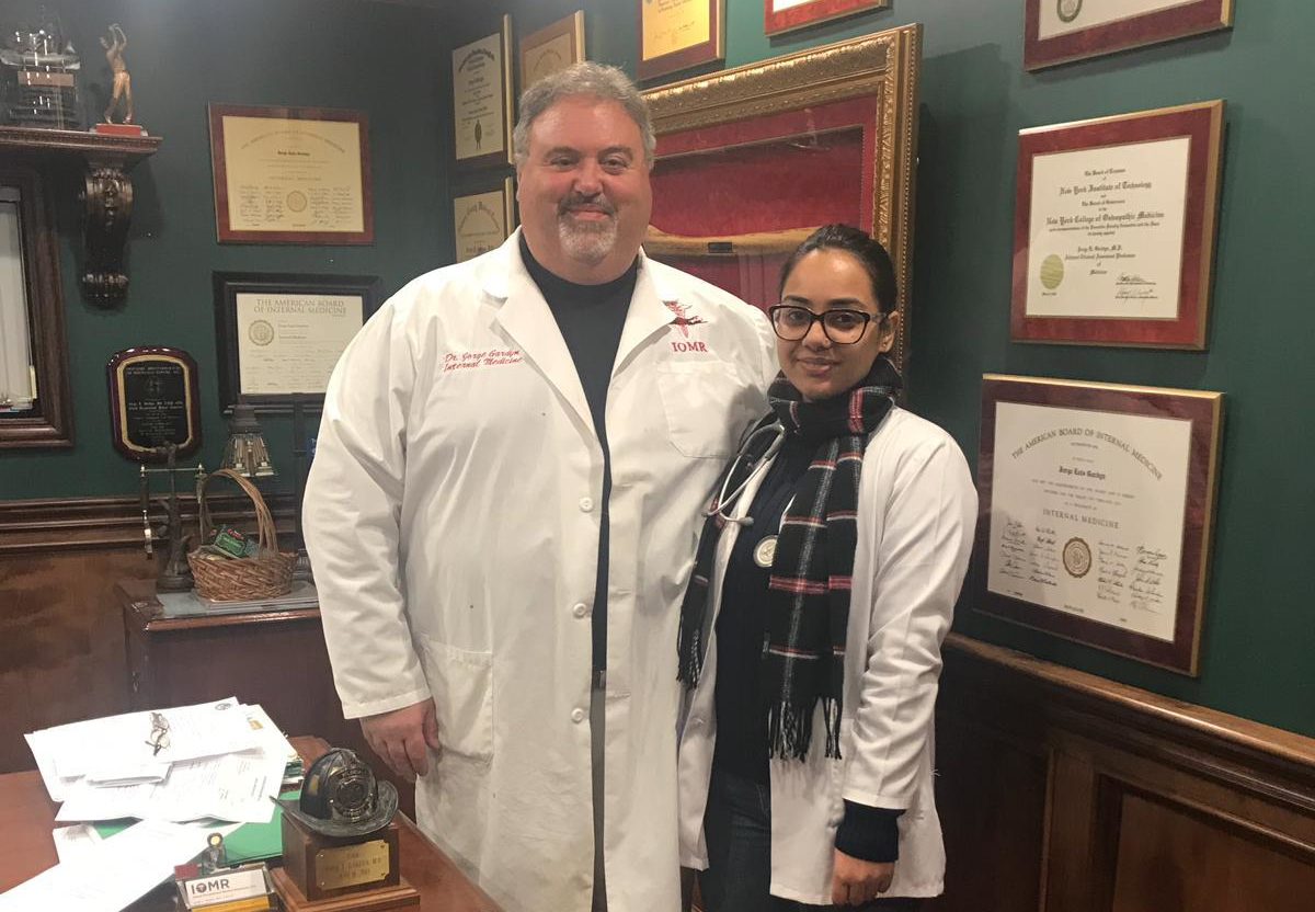 Jisa poses for a picture with her precepting physician during her U.S. clinical experience in Manhattan